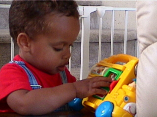 Playing with His Bus